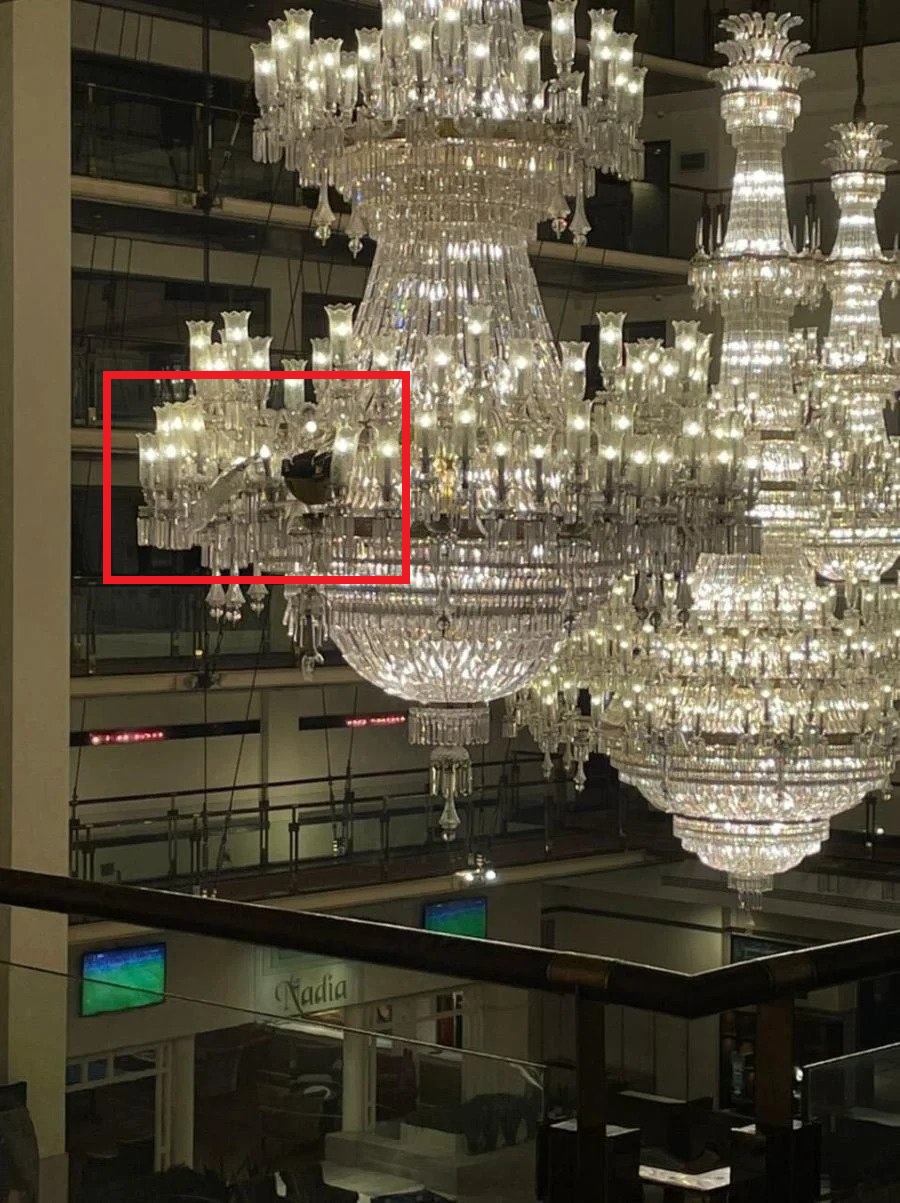 faulkner helmet and bat stuck in chandelier in Pakistan hotel